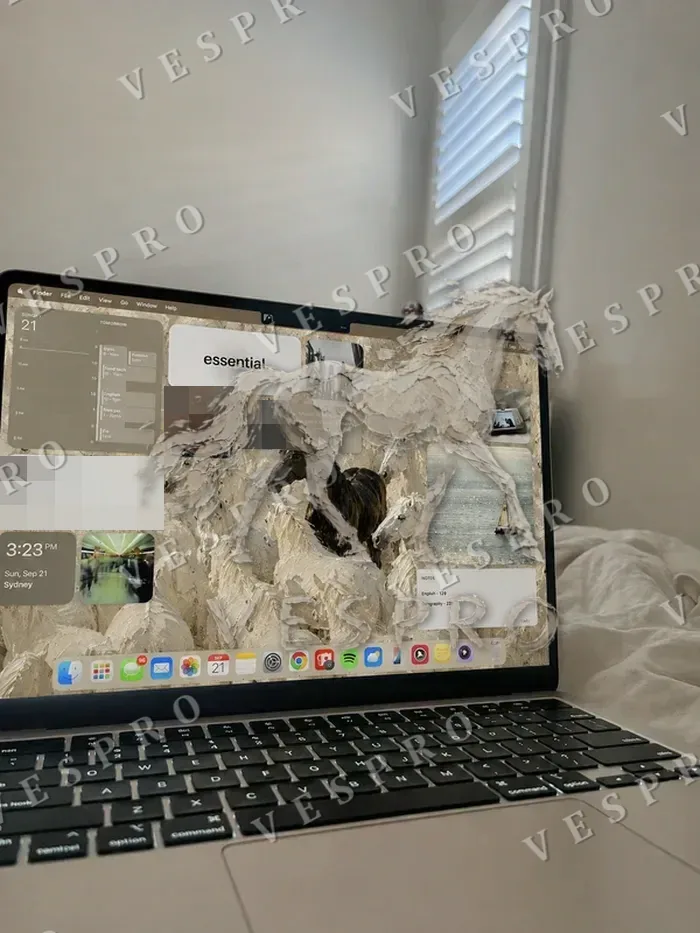 VESPRO wallpaper on a laptop desktop